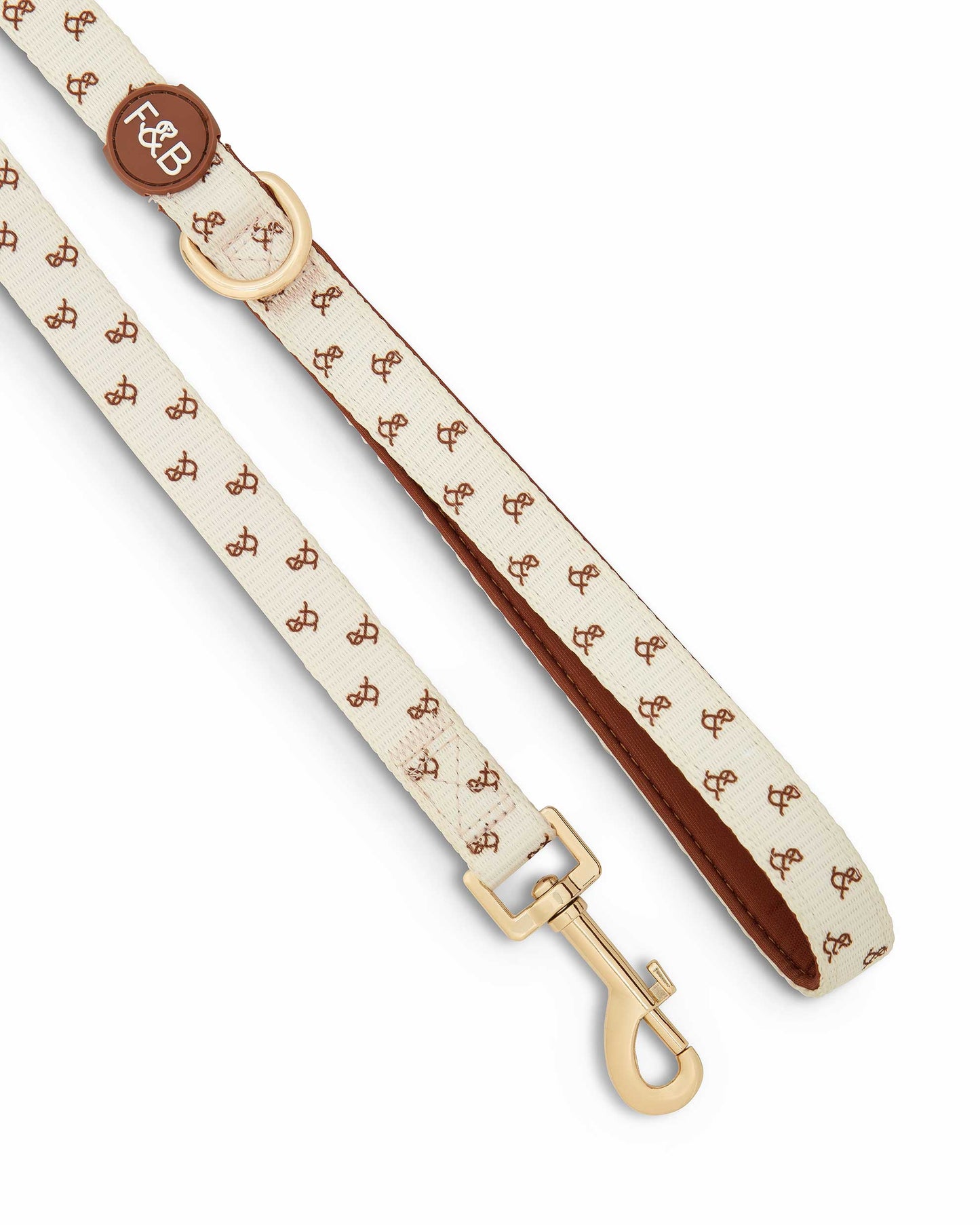 Close-up of the Fetch and Bark Neoprene Lead, showcasing the waterproof neoprene material, durable gold hardware, and high-tensile clip for a secure and stylish walking experience. The lead is covered in the signature Fetch and Bark logo for added brand detail. Length: 147cm for the perfect fit and control.