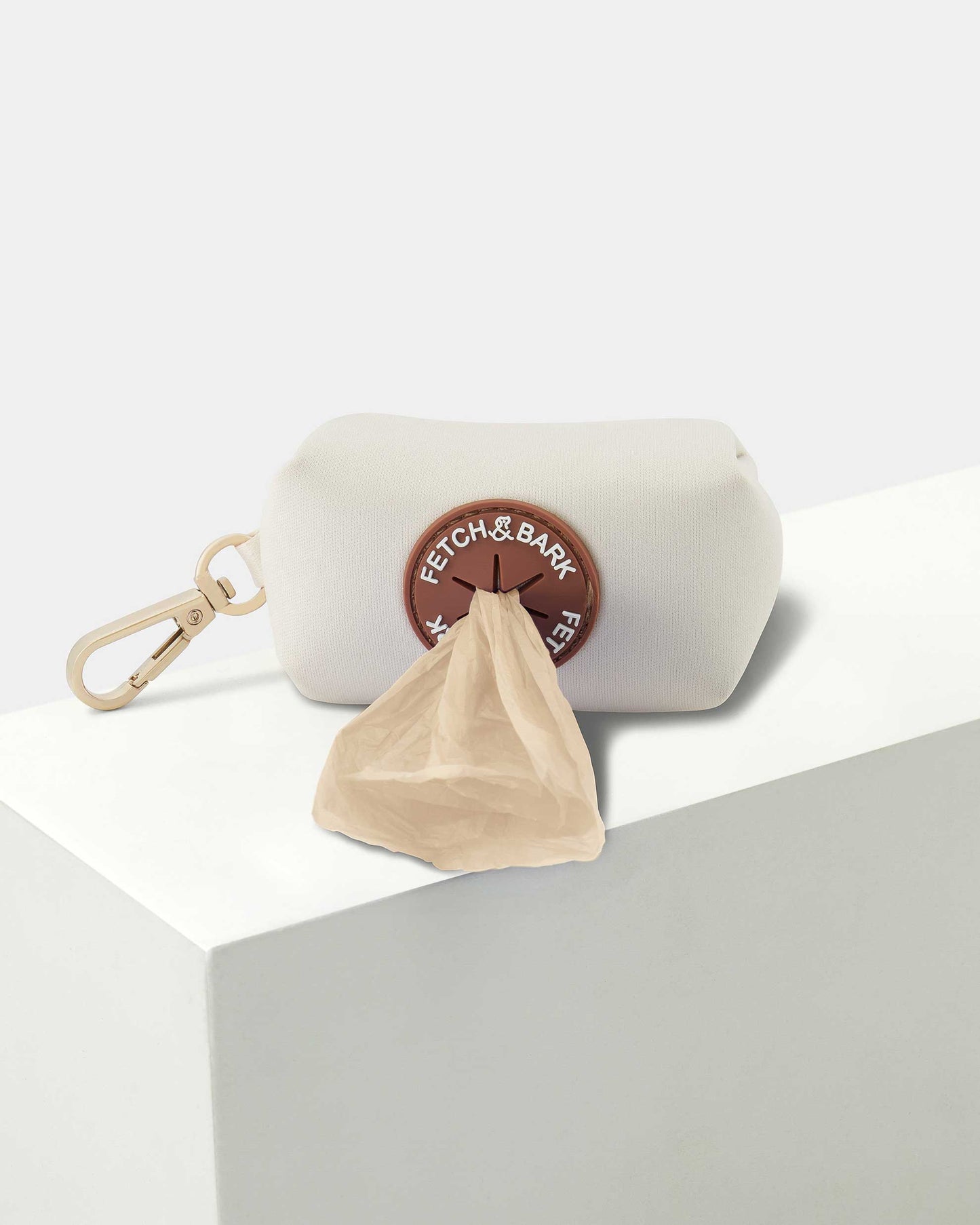 Close-up of the Fetch and Bark Neoprene Waste Bag Holder, featuring waterproof neoprene material, durable gold hardware, and a convenient design for easy waste bag access during walks. Dimensions: 10cm x 6cm for a compact and functional fit.