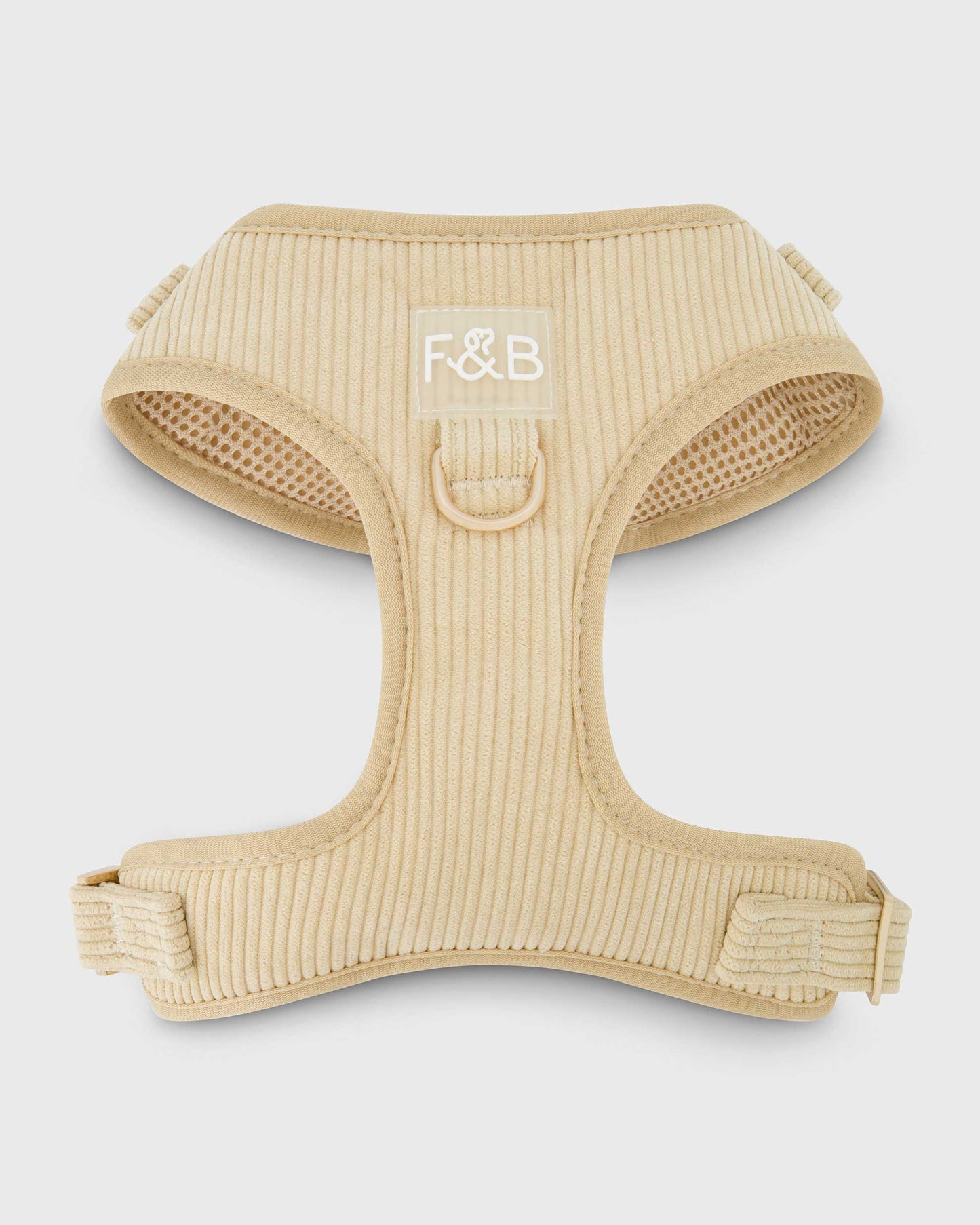 Front view of the Fetch and Bark Corduroy Harness in Cream, showcasing the elegant corduroy texture and our signature Fetch and Bark logo at the center for a stylish and secure fit for dogs