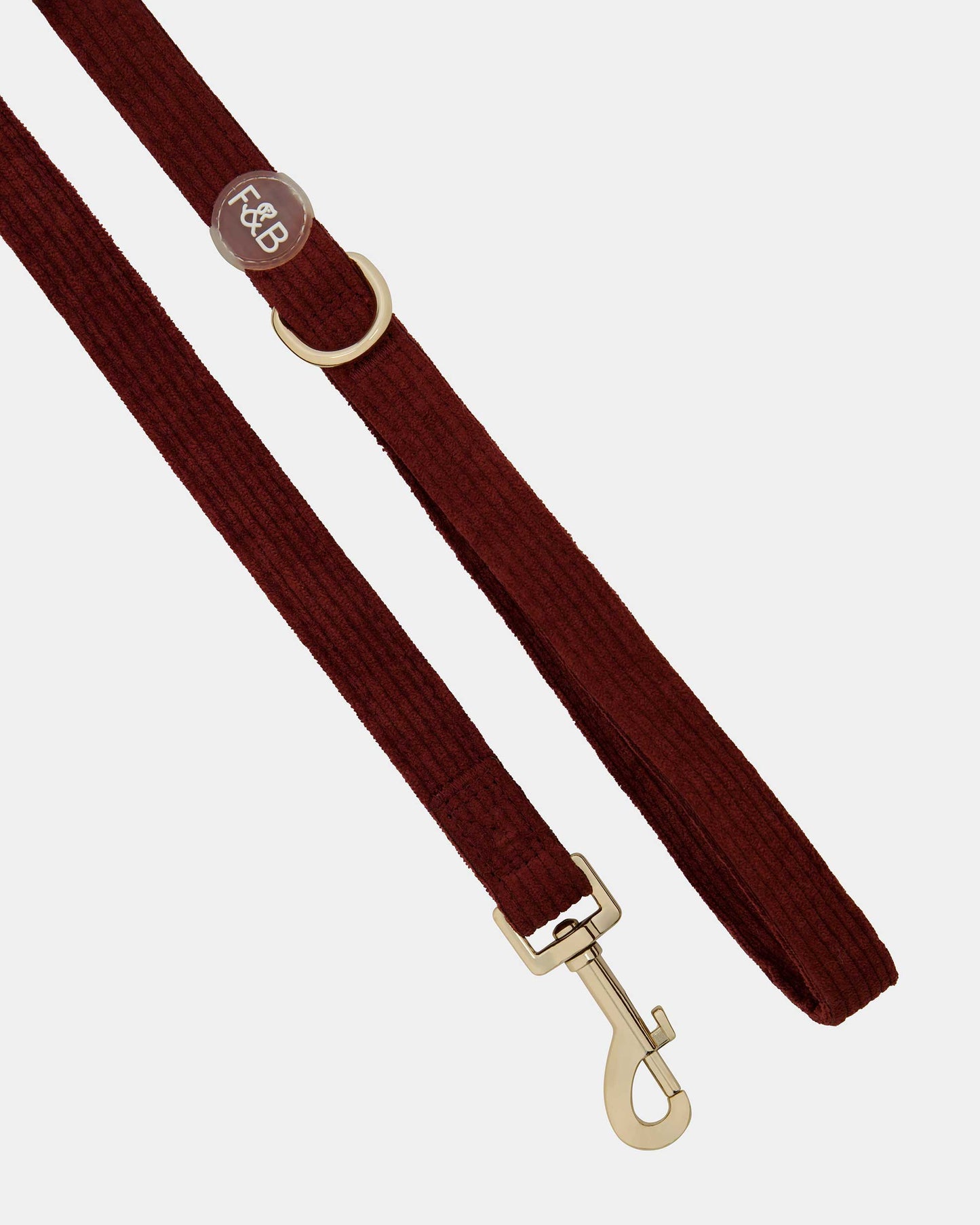 Close-up of the Fetch and Bark Corduroy Lead in Mahogany, featuring a luxurious corduroy texture, durable gold hardware, and a high-tensile clip for a secure and stylish walking experience.