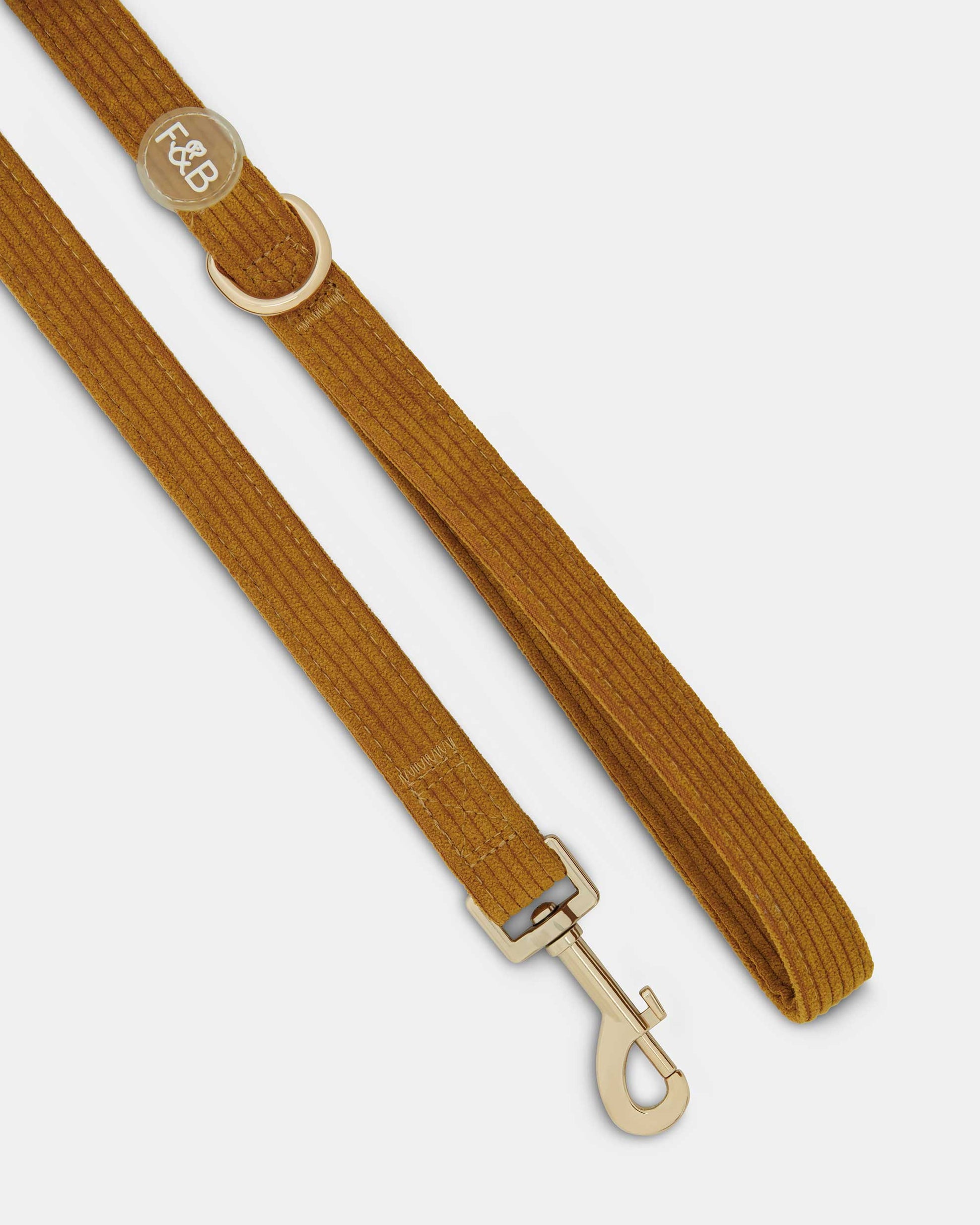 Close-up of the Fetch and Bark Corduroy Lead in Ochre, featuring a luxurious corduroy texture, durable gold hardware, and a high-tensile clip for a secure and stylish walking experience.Lead is 147cm long